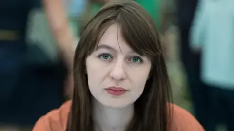 Irish author Sally Rooney claims she will not travel to the UK because of potential arrest